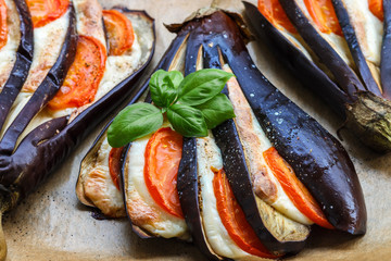 Baked eggplant with cheese, tomatoes, spices and Basil