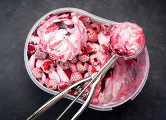 Raspberry ice cream sorbet and spoon for ice cream
