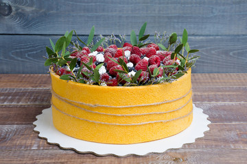 a summer fruit cake rolled in  yellow biscuit