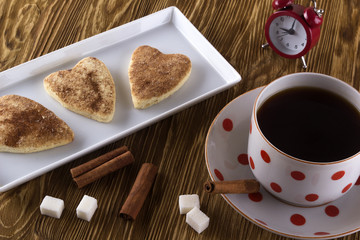 Cup of tea with cinnamon cookies.