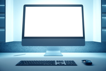 Office desktop with blank laptop
