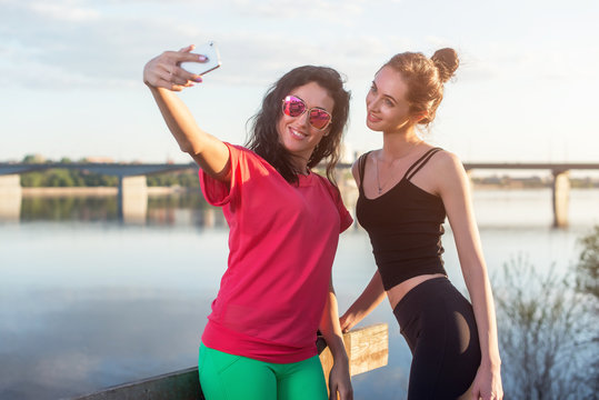 Women taking picture of herself, selfie at beach Lifestyle sunny image best friend girls happy vacations.