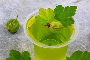 gooseberry jelly on a gray stone background top view