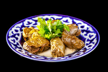 Caucasian and Asian national dish - stuffed grape leaves with me