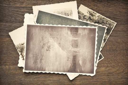 Vintage photos on wooden background