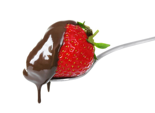 Juicy strawberry in chocolate on white background