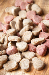 The image of dog food on a wooden table