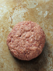 rustic uncooked hamburger patty