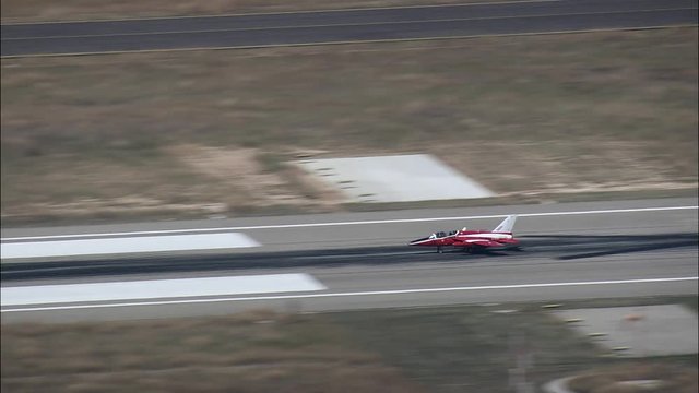 Small Red Jet Landing At Valladolid Airport