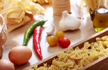 Raw farfalle in a box