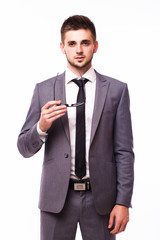 Young businessman take over glasses and look at camera