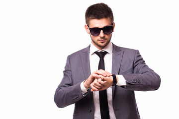 Young businessman look at clock on time