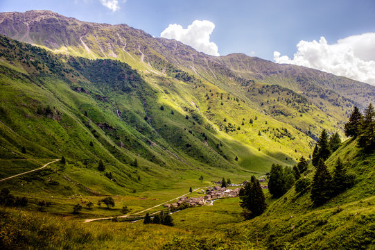 Clouds cover village on a mountaing view (Ponte di legno, Case d