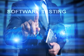 Businessman is pressing on the virtual screen and selecting Software testing.