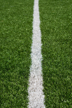 Green soccer field turf with white painted line