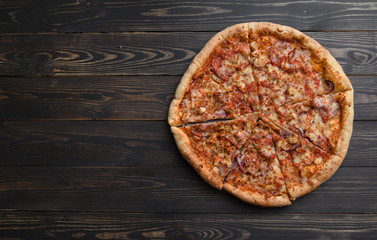 pizza on a wooden background - 116127151