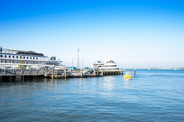 Fototapeta na wymiar dock with ships in blue sky in san francisco