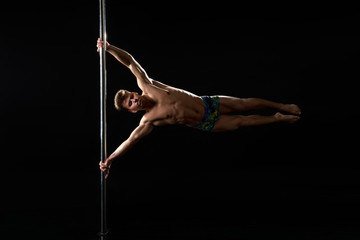 Pole dance. Image of dancer with strained face