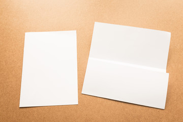 White paper note on business wood desk with copy space.
