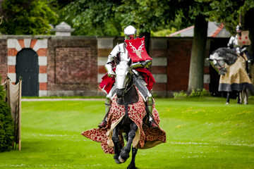 Armored knight suited for battle on horseback, charging in gallop. Galloping it’s the fastest...