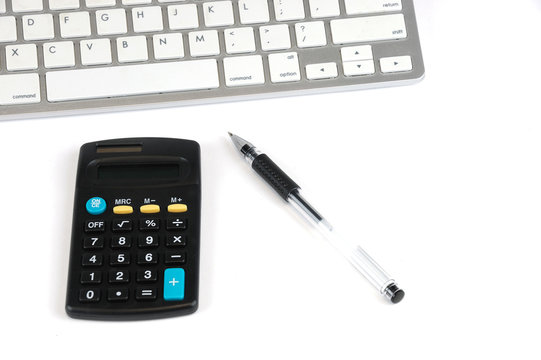 Keyboard, Calculator And Pen Isolated On White Background