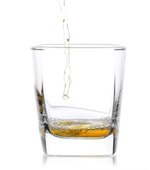 Glass of scotch whiskey  on a white background