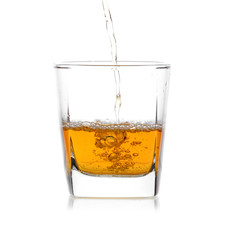 Glass of scotch whiskey  on a white background