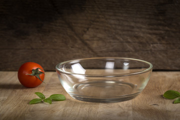 Empty glass bowl on wood