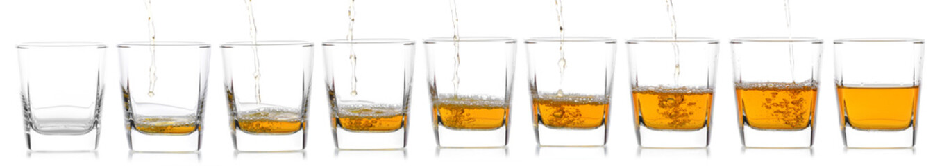 Glass of scotch whiskey  on a white background