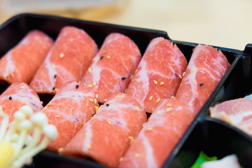 Raw kurobuta pork slices on plates, for sukoyaki and yakiniku ho