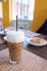 Iced mocha coffee with milk is on the mat