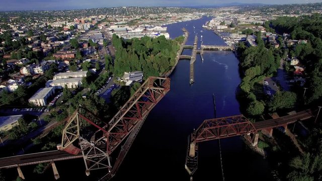 Aerial Flying Towards Salmon Bay Bridge, City of Ballard and Hiram M Chittenden Locks in Seattle, Washington