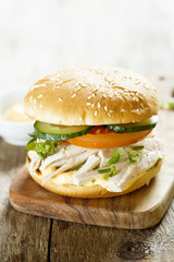 Chicken burger with cucumber and tomatoes