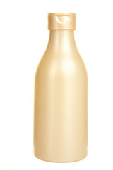 a gold bottle on a white isolated background