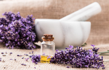 spa massage setting, lavender product, oil on nature background
