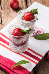 Chia seed pudding with strawberry and fresh fruits with nature background 