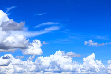 Fototapeta na wymiar Blue sky background with white clouds and rain clouds. The vast blue sky and clouds sky on sunny day. White fluffy clouds in the blue sky.