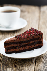 Tasty vegetarian chocolate dessert on wooden table for celebrati