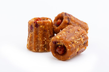 Delicious candies anthill isolated on white background.