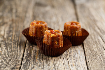 Delicious vegetarian candies anthill on wooden table for snack.