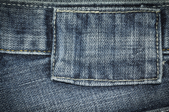 Denim jeans texture background with label of fashion jeans design with copy space for text or image.