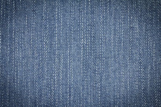 Denim jeans texture or denim jeans background of fashion jeans design with copy space for text or image. Dark edged.