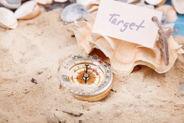 Fototapeta na wymiar Compass in the sand with Message - Target