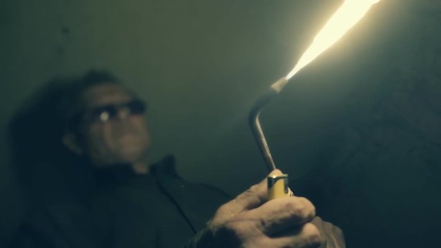 Welding works on a black background and a lot of sparks. Slow motion, high speed camera, 250fps