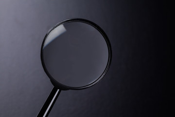 magnifying glass on dark background