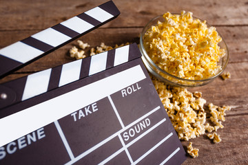 Movie clapper board and pop corn