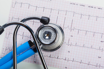 metal stethoscope on cardiogram
