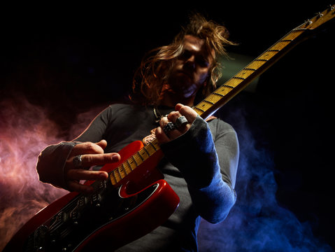 The guitarist plays solo.