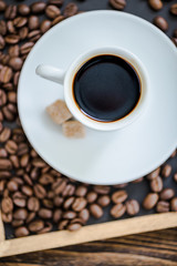 Fototapeta premium espresso coffee on roasted coffee beans