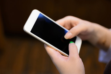 Two hands are holding the smartphone.